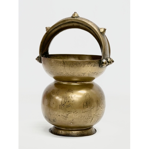 57 - An Early 20th Century Jeypore School of Arts, Indian brass holy water vessel. 16x15x26cm