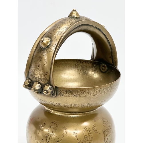 57 - An Early 20th Century Jeypore School of Arts, Indian brass holy water vessel. 16x15x26cm