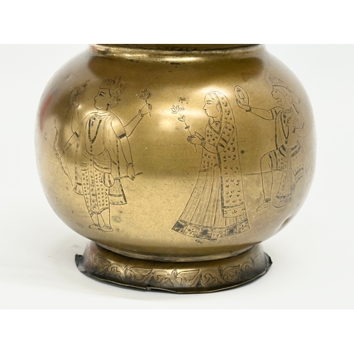 57 - An Early 20th Century Jeypore School of Arts, Indian brass holy water vessel. 16x15x26cm