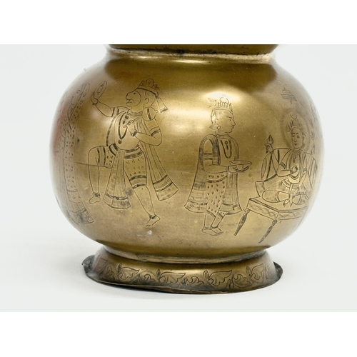 57 - An Early 20th Century Jeypore School of Arts, Indian brass holy water vessel. 16x15x26cm