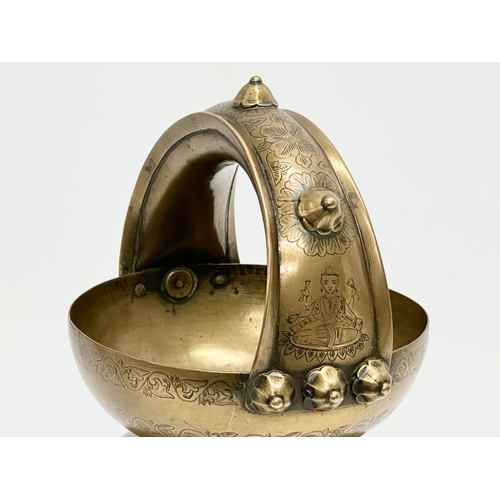 57 - An Early 20th Century Jeypore School of Arts, Indian brass holy water vessel. 16x15x26cm