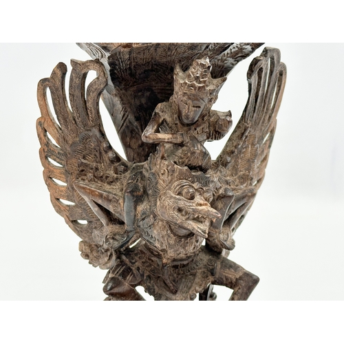 144 - A Late 19th Century carved padauk ‘Vishnu and Garuda’ statue. 14x20cm