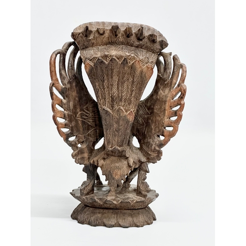 144 - A Late 19th Century carved padauk ‘Vishnu and Garuda’ statue. 14x20cm