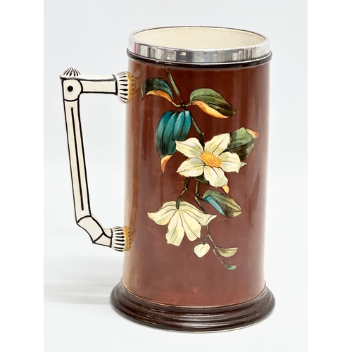 158 - A large Late 19th Century hand painted tankard with silver plated rim. 17x21cm