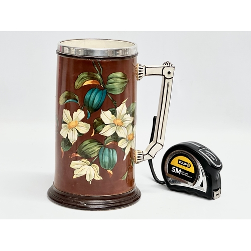 158 - A large Late 19th Century hand painted tankard with silver plated rim. 17x21cm