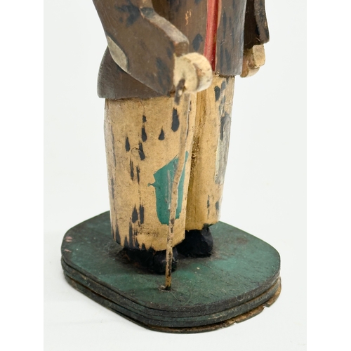 416 - An Early 20th Century Folk Art wooden Charlie Chapman figure. 13cm