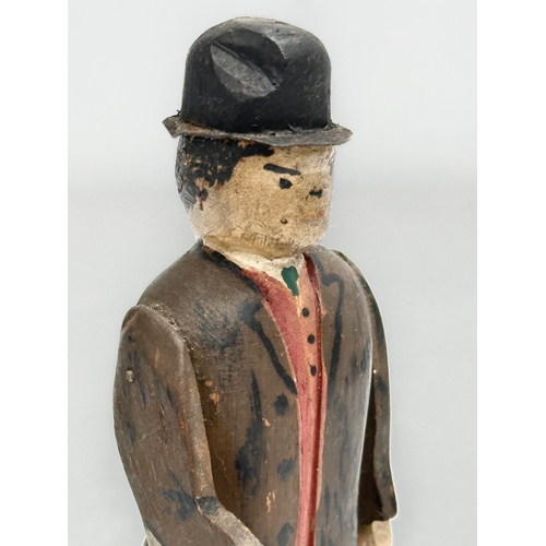 416 - An Early 20th Century Folk Art wooden Charlie Chapman figure. 13cm