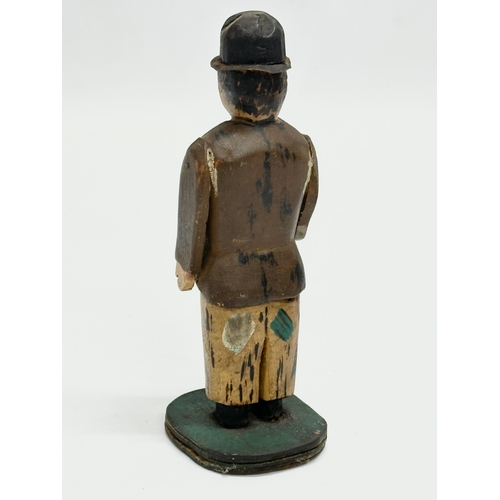 416 - An Early 20th Century Folk Art wooden Charlie Chapman figure. 13cm