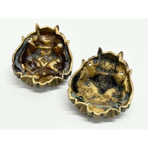 162 - A pair of brass Feng Shui mask wall mounts. Circa 1900. 7.5x9cm