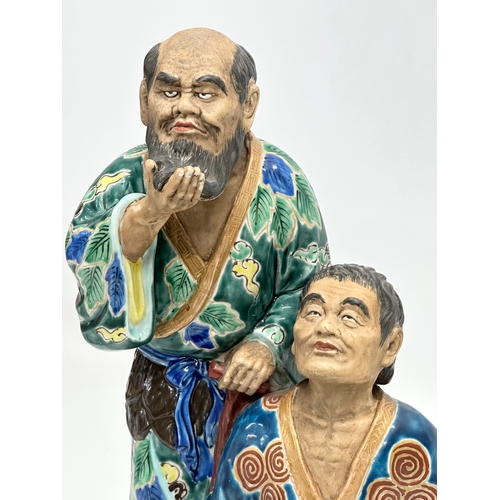 164 - A large Early 20th Century Japanese ‘Immortals’ figurine. 21x33cm