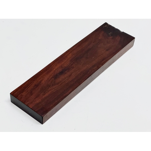 178 - A 19th Century rosewood cribbage board. 27.5x7.5x2.5cm