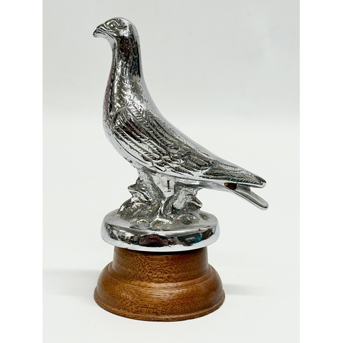 180 - A 1930’s chrome ‘Homing Pigeon’ car mascot on stand. 14.5cm