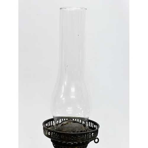 33 - A Early 20th Century ceramic ‘Hatchet & Gimlet’s’ Fashionable Hardware Store advertising oil lamp.