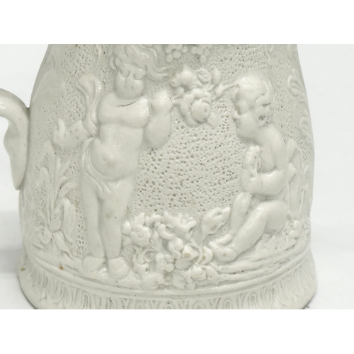 421 - A Mid 19th Century Worthington & Green relief moulded jug. 15x11x14cm