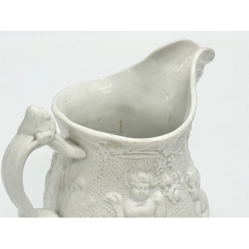 421 - A Mid 19th Century Worthington & Green relief moulded jug. 15x11x14cm