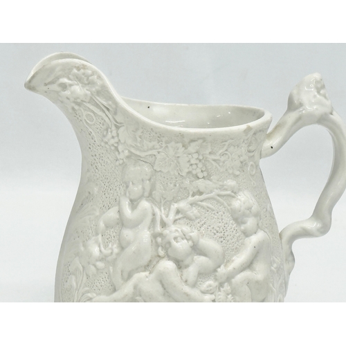 421 - A Mid 19th Century Worthington & Green relief moulded jug. 15x11x14cm