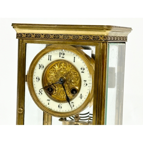 36 - A large Late 19th Century French brass mantle clock with 4 bevelled glass panels and mercury pendulu... 