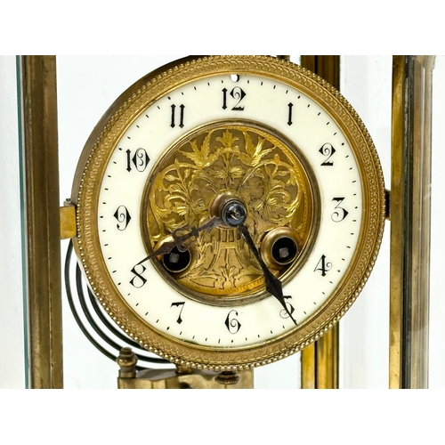 36 - A large Late 19th Century French brass mantle clock with 4 bevelled glass panels and mercury pendulu... 