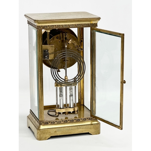 36 - A large Late 19th Century French brass mantle clock with 4 bevelled glass panels and mercury pendulu... 