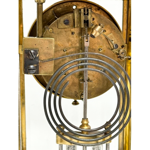 36 - A large Late 19th Century French brass mantle clock with 4 bevelled glass panels and mercury pendulu... 