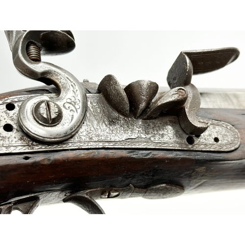 24 - An Early 19th Century Irish flintlock pistol by Thomas Fowler. 27cm