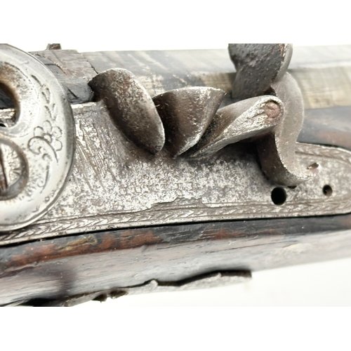 24 - An Early 19th Century Irish flintlock pistol by Thomas Fowler. 27cm