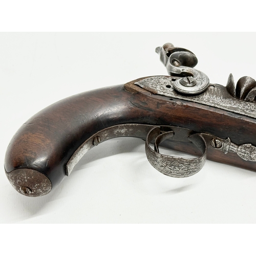 24 - An Early 19th Century Irish flintlock pistol by Thomas Fowler. 27cm