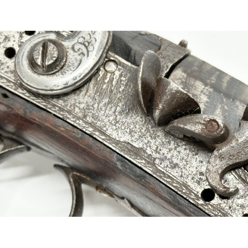 24 - An Early 19th Century Irish flintlock pistol by Thomas Fowler. 27cm