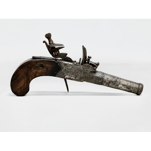 25 - A Late 18th/19th Century boxlock flintlock pistol. 17cm