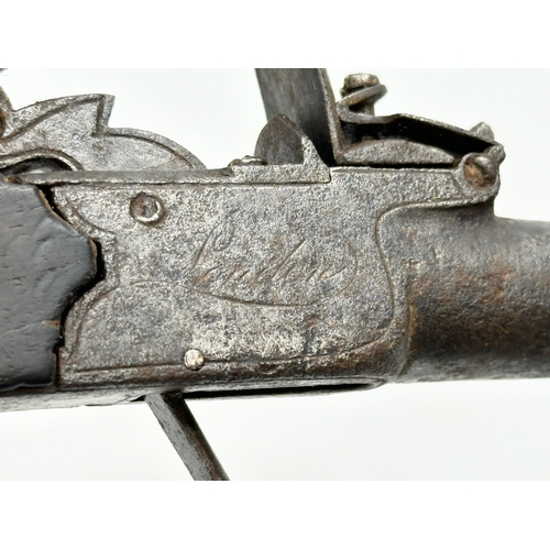 25 - A Late 18th/19th Century boxlock flintlock pistol. 17cm