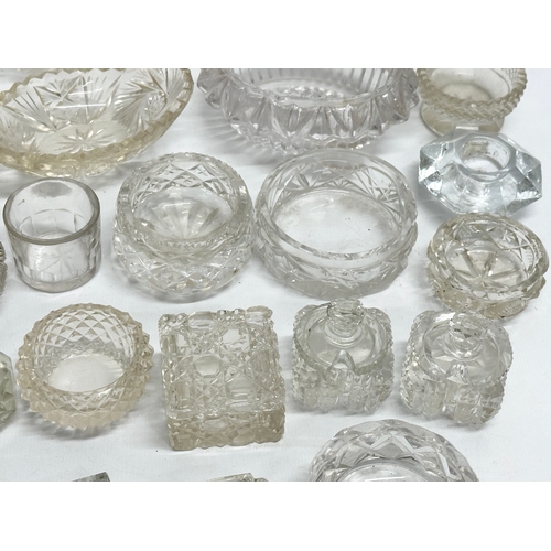 198 - A collection of 19th Century glass salts, match holders etc.