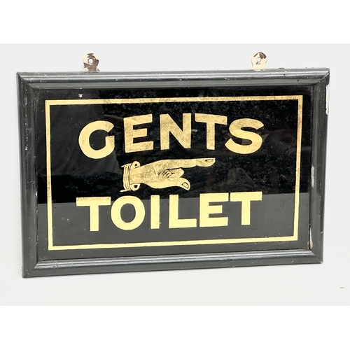 151 - A Late 19th/Early 20th Century ‘Gents Toilet’ sign. Painted under glass with wooden frame. 44x29cm.