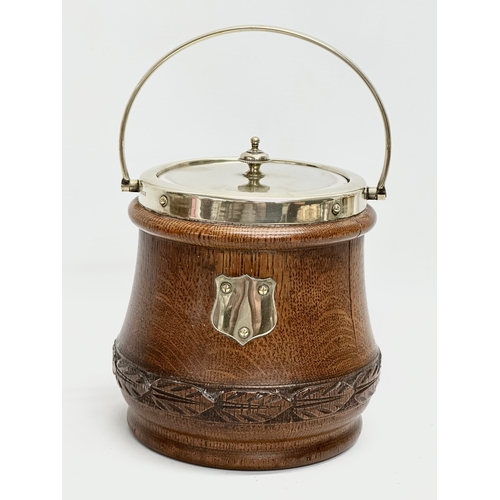 240 - A set of Edwardian oak kitchenware. A large Edwardian oak ‘trophy’ fruit bowl with original Baker & ... 