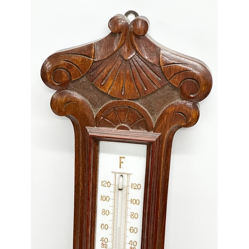 247 - An Early 20th Century oak barometer. Circa 1900. 76cm