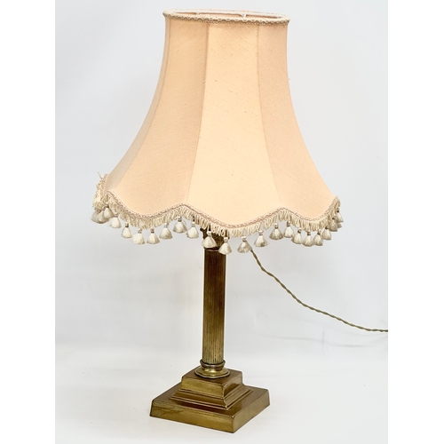 172 - A vintage brass table lamp with Corinthian style and reeded column. 64cm