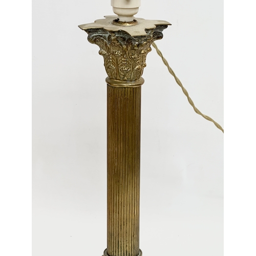 172 - A vintage brass table lamp with Corinthian style and reeded column. 64cm