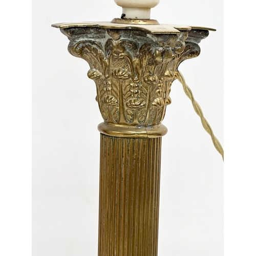 172 - A vintage brass table lamp with Corinthian style and reeded column. 64cm