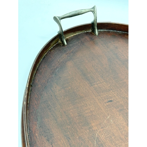 254 - An Edwardian inlaid mahogany serving tray. 62x37cm