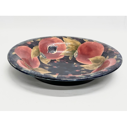 119 - A large signed Early 20th Century William Moorcroft ‘Pomegranate’ shallow fruit bowl. Impressed mark... 