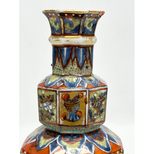 109 - An unusual 19th Century Japanese hand painted 4 tier vase. Mark underneath. 24cm