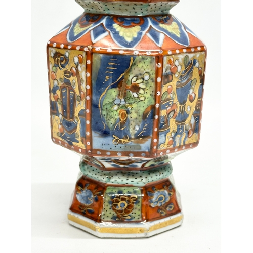 109 - An unusual 19th Century Japanese hand painted 4 tier vase. Mark underneath. 24cm