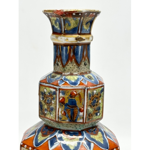 109 - An unusual 19th Century Japanese hand painted 4 tier vase. Mark underneath. 24cm