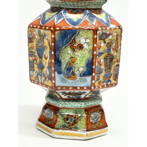 109 - An unusual 19th Century Japanese hand painted 4 tier vase. Mark underneath. 24cm