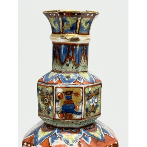 109 - An unusual 19th Century Japanese hand painted 4 tier vase. Mark underneath. 24cm