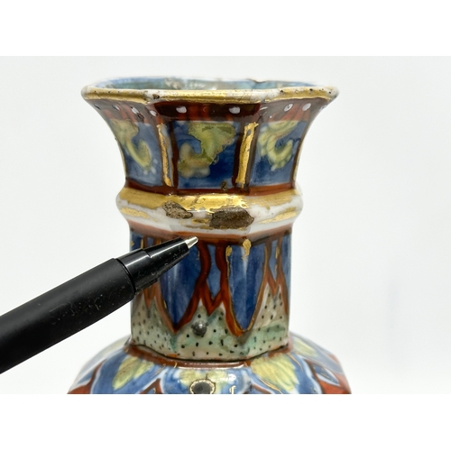 109 - An unusual 19th Century Japanese hand painted 4 tier vase. Mark underneath. 24cm