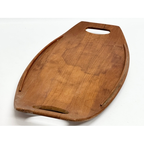 38 - A Danish Mid Century teak tray designed by Jens Quistgaard for Dansk Designs. 1950/1960. 52x26cm