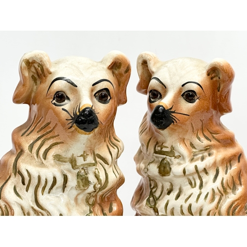 281 - A pair of large Late 19th Century Staffordshire Pottery Wally Dogs with glass eyes. 22x31cm