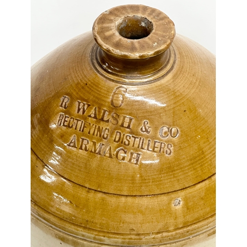 283 - A large R. Walsh & Co stoneware flagon. Armagh, Northern Ireland. Rectifying Distillers. 54cm