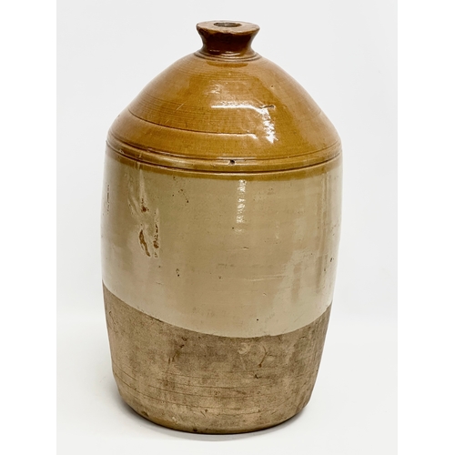 283 - A large R. Walsh & Co stoneware flagon. Armagh, Northern Ireland. Rectifying Distillers. 54cm