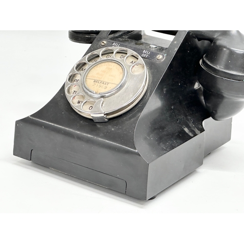 403 - A vintage Bakelite telephone.